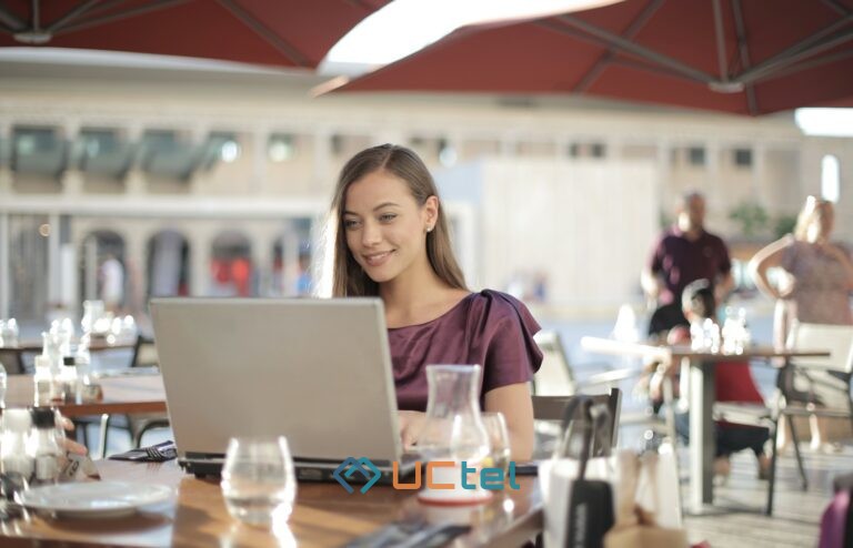 Woman working on a laptop in a café