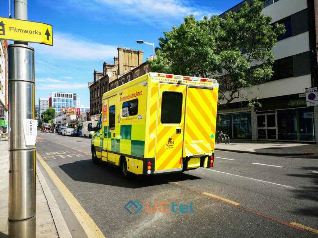 NHS mobile signal installation van parked outside a hospital building