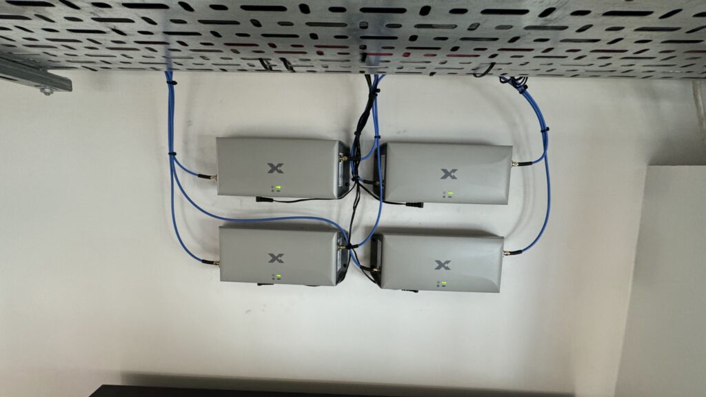 UCtel engineers installing Nextivity Cel-Fi mobile signal boosters in a UK commercial building